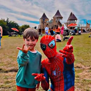 Spiderhero posing with a little boy at Lee Valley